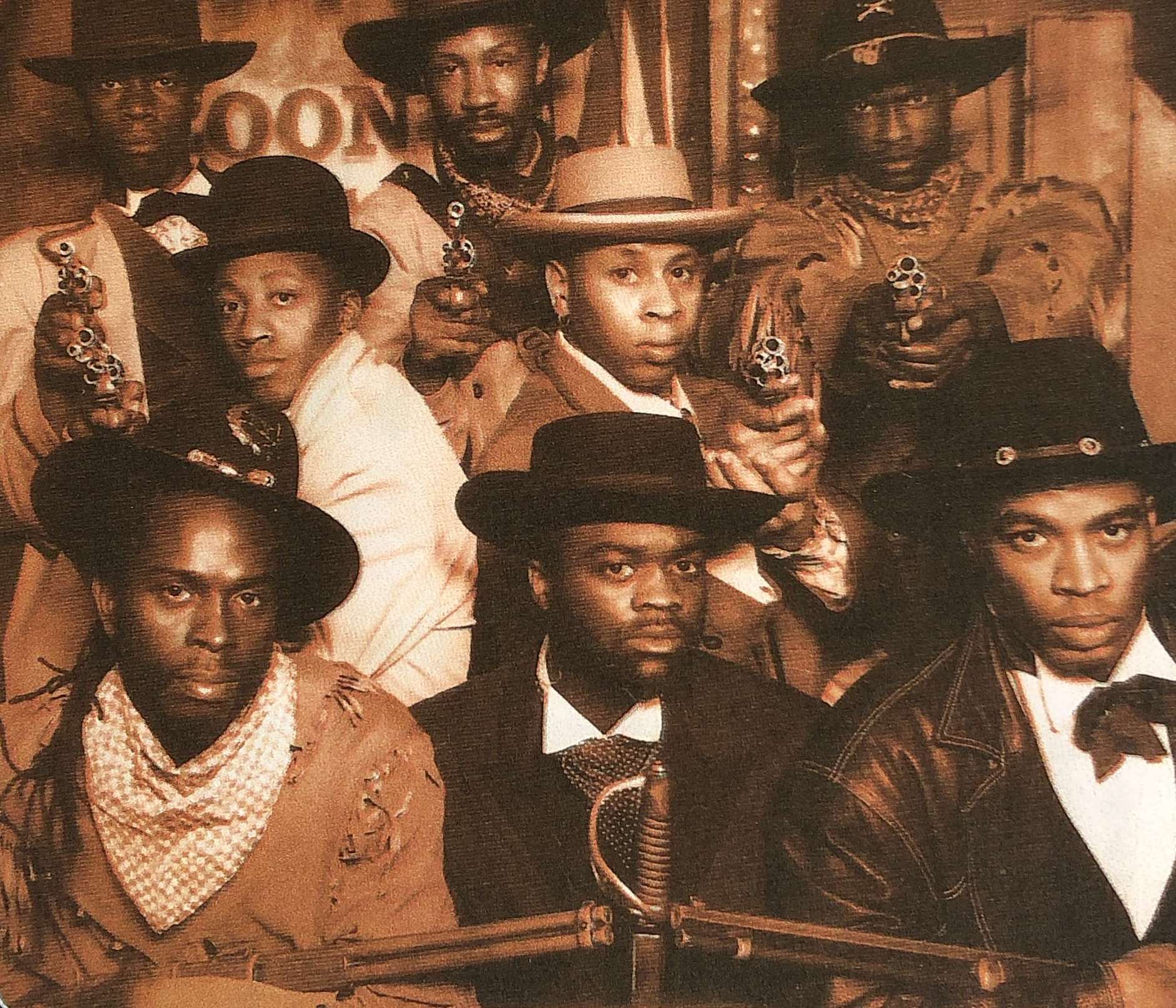 Top row L-R: Robbie Gee, Brian Bovell and Sylvester Williams Middle row L-R: Michael Buffong and Roger Griffiths Bottom row L-R: Victor Romero Evans, Eddie Nestor and Gary McDonald ARMED AND DANGEROUS written and performed by The Posse, 1992